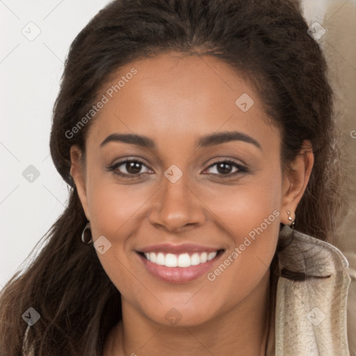 Joyful latino young-adult female with long  brown hair and brown eyes