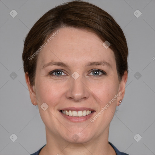 Joyful white adult female with short  brown hair and grey eyes