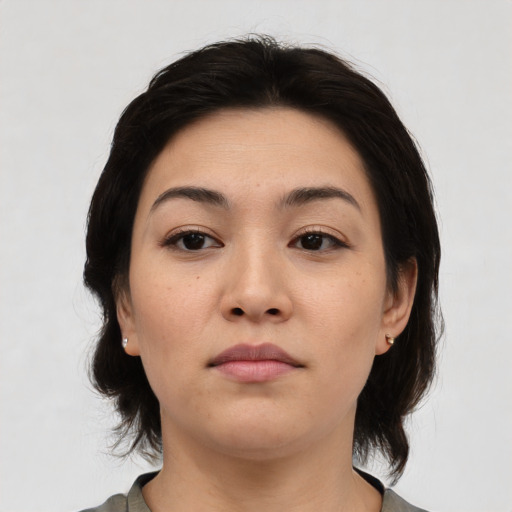 Neutral asian young-adult female with medium  brown hair and brown eyes
