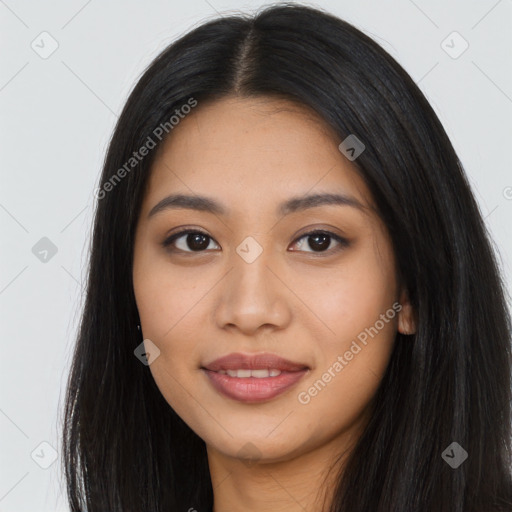 Joyful asian young-adult female with long  black hair and brown eyes