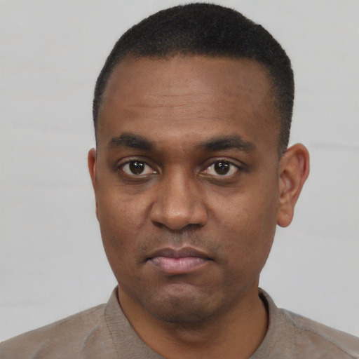 Neutral black young-adult male with short  black hair and brown eyes