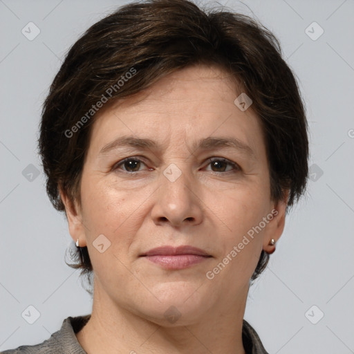 Joyful white adult female with medium  brown hair and grey eyes