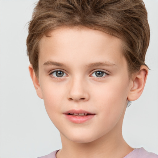 Joyful white child male with short  brown hair and brown eyes