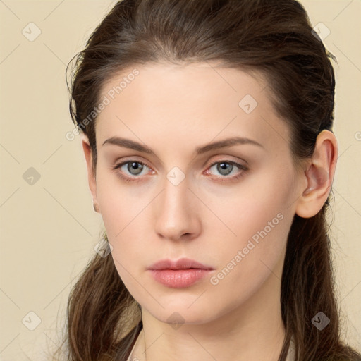 Neutral white young-adult female with long  brown hair and brown eyes