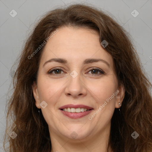 Joyful white adult female with long  brown hair and brown eyes