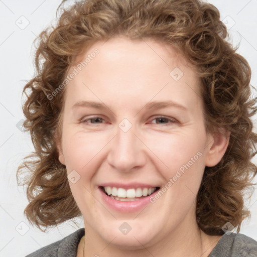 Joyful white young-adult female with medium  brown hair and blue eyes