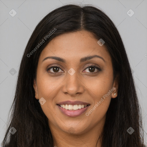 Joyful latino young-adult female with long  brown hair and brown eyes