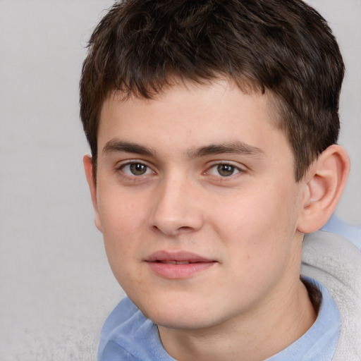 Joyful white child male with short  brown hair and brown eyes