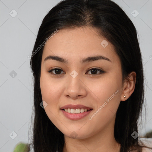 Joyful white young-adult female with long  brown hair and brown eyes