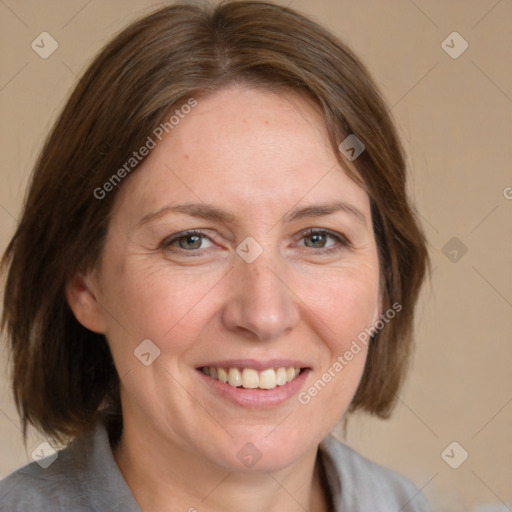 Joyful white adult female with medium  brown hair and blue eyes