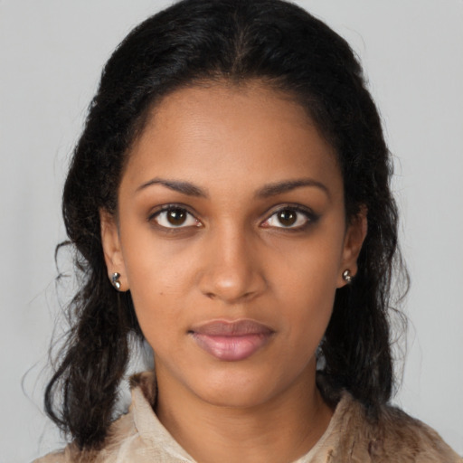 Neutral black young-adult female with long  brown hair and brown eyes
