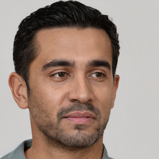 Neutral latino young-adult male with short  black hair and brown eyes