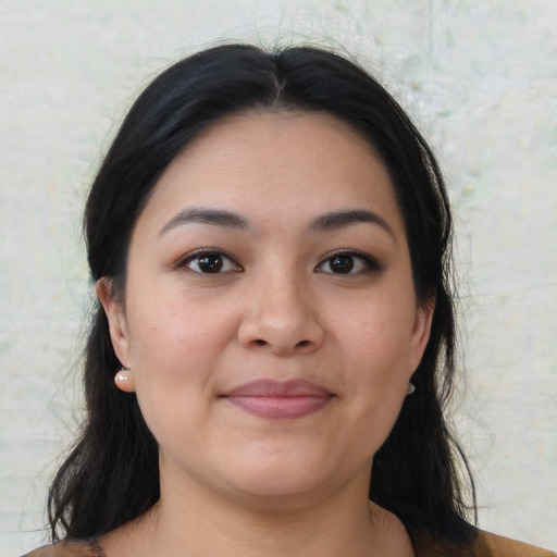 Joyful asian young-adult female with medium  black hair and brown eyes