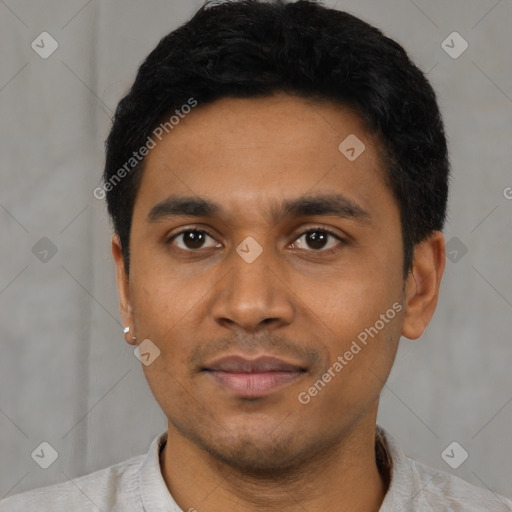 Joyful latino young-adult male with short  black hair and brown eyes