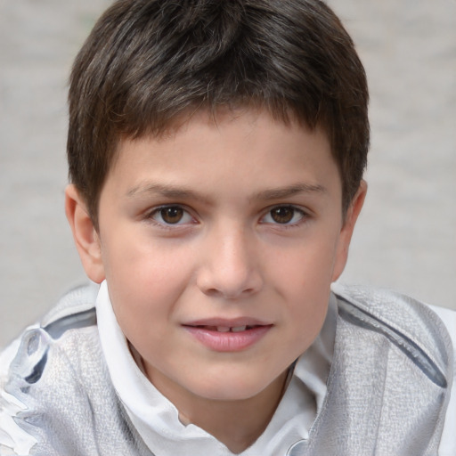 Joyful white child male with short  brown hair and brown eyes