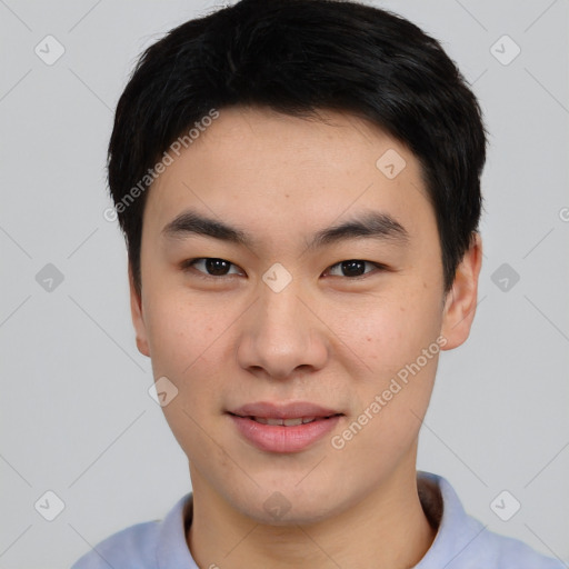 Joyful asian young-adult male with short  black hair and brown eyes