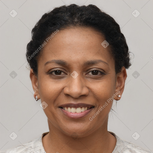 Joyful black adult female with short  brown hair and brown eyes