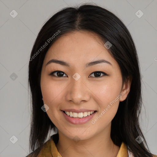 Joyful latino young-adult female with long  brown hair and brown eyes