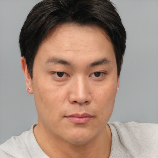Neutral asian young-adult male with short  brown hair and brown eyes
