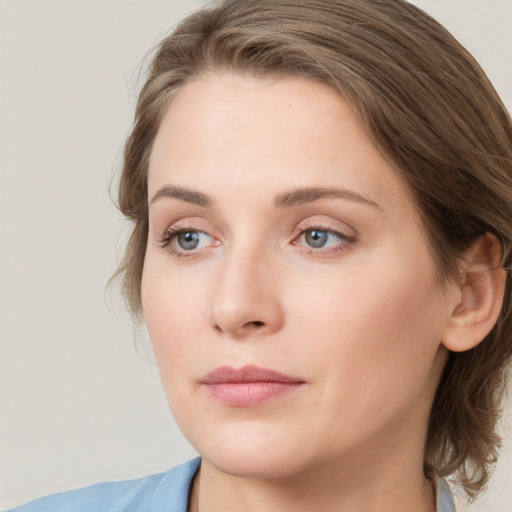 Neutral white young-adult female with medium  brown hair and grey eyes