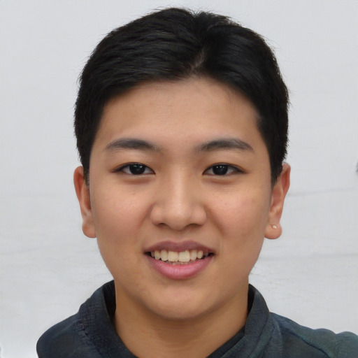 Joyful asian young-adult female with short  black hair and brown eyes