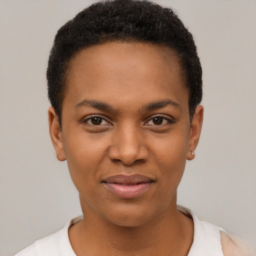 Joyful black young-adult female with short  black hair and brown eyes