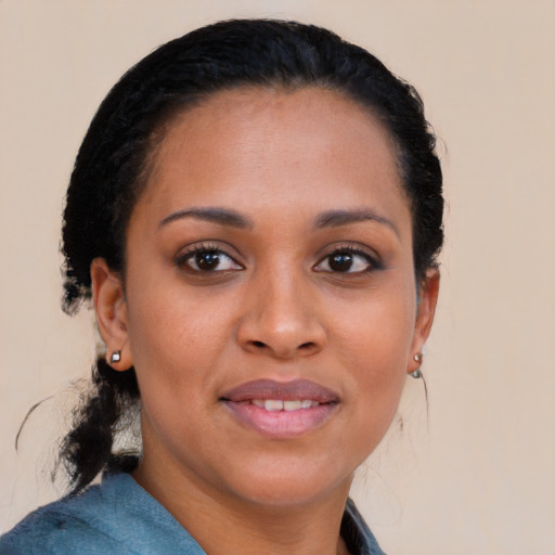 Joyful black young-adult female with medium  black hair and brown eyes