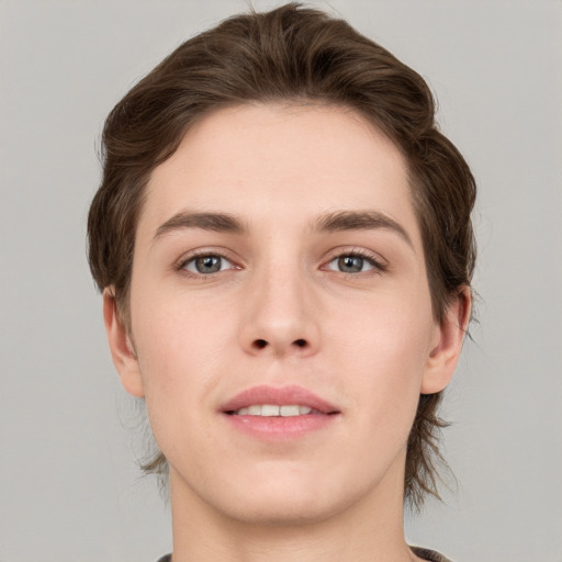 Joyful white young-adult female with medium  brown hair and grey eyes