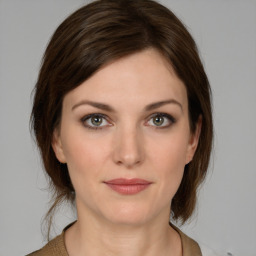 Neutral white young-adult female with medium  brown hair and grey eyes