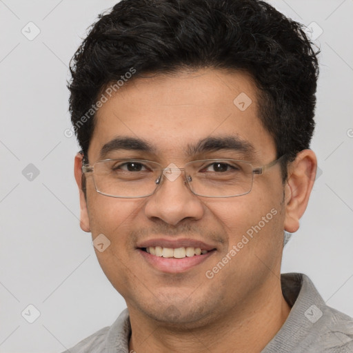 Joyful white young-adult male with short  black hair and brown eyes