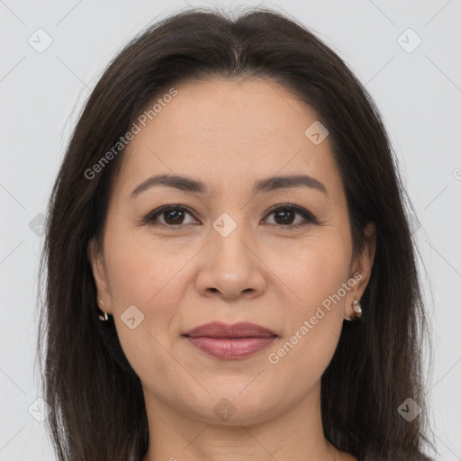 Joyful white adult female with long  brown hair and brown eyes