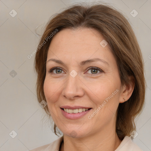 Joyful white adult female with medium  brown hair and brown eyes