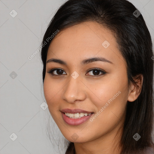 Joyful asian young-adult female with long  brown hair and brown eyes