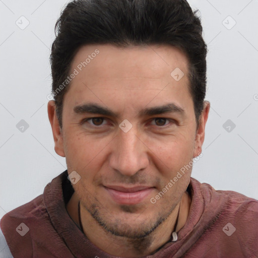 Joyful white adult male with short  brown hair and brown eyes