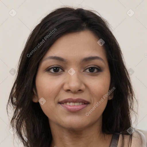 Joyful latino young-adult female with long  brown hair and brown eyes