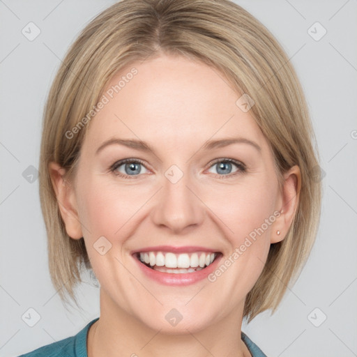 Joyful white adult female with medium  brown hair and blue eyes