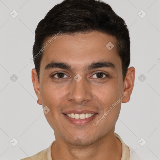 Joyful white young-adult male with short  brown hair and brown eyes