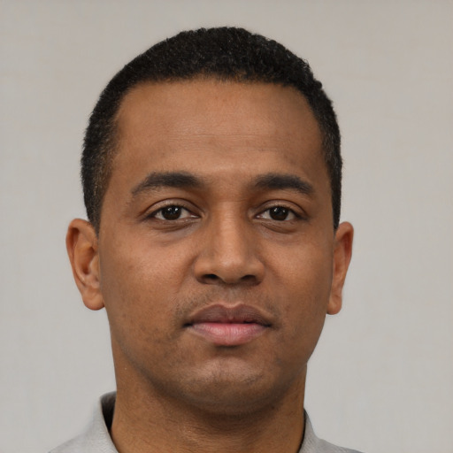 Neutral black young-adult male with short  black hair and brown eyes