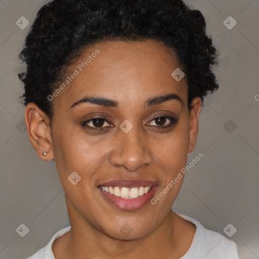 Joyful black young-adult female with short  brown hair and brown eyes