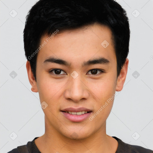 Joyful asian young-adult male with short  black hair and brown eyes