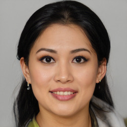 Joyful asian young-adult female with medium  black hair and brown eyes