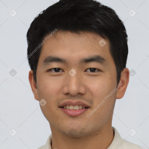 Joyful asian young-adult male with short  black hair and brown eyes