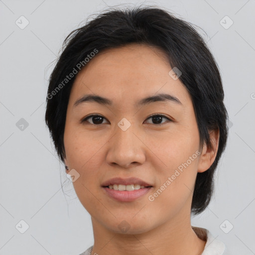 Joyful asian young-adult female with medium  black hair and brown eyes