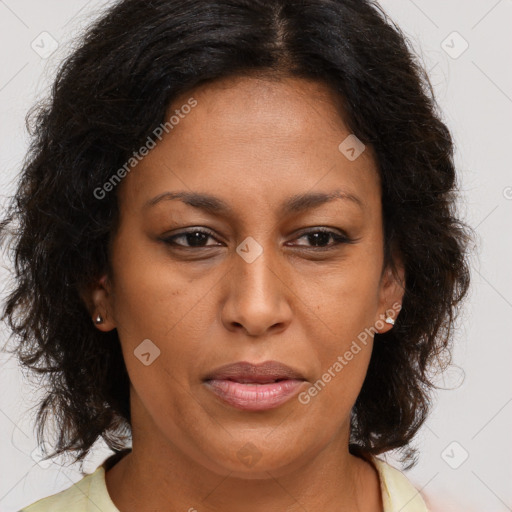 Joyful latino adult female with medium  brown hair and brown eyes