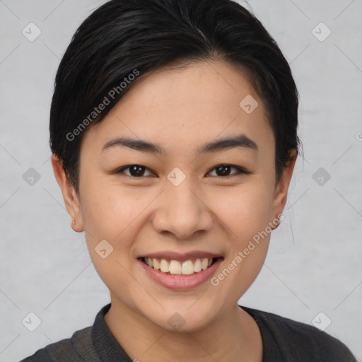 Joyful asian young-adult female with short  brown hair and brown eyes