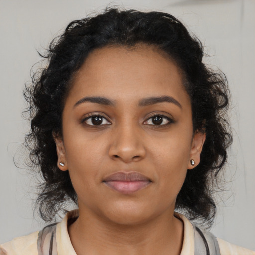 Neutral black young-adult female with medium  brown hair and brown eyes