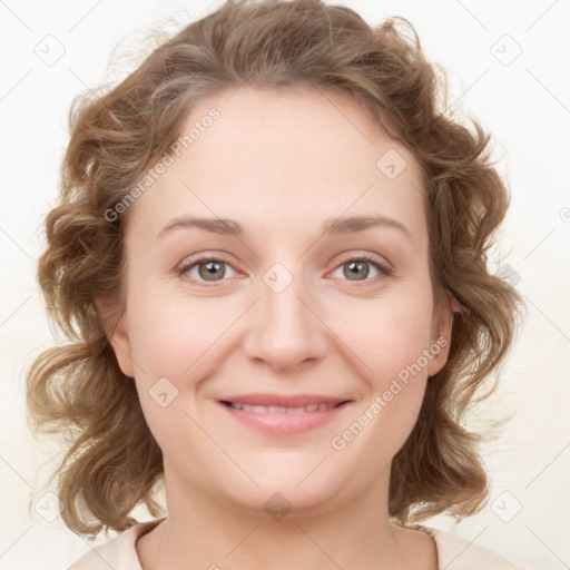 Joyful white young-adult female with medium  brown hair and blue eyes