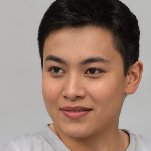 Joyful asian young-adult female with short  brown hair and brown eyes