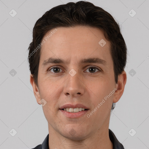 Joyful white adult male with short  brown hair and brown eyes