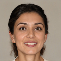 Joyful white young-adult female with medium  brown hair and brown eyes